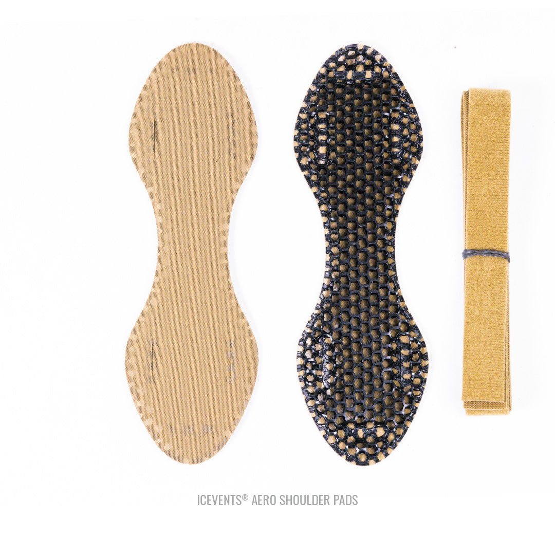 Flat-lay of Coyote Brown OneWrap tape and ICEVENTS Aero shoulder pads in Coyote Brown showing curved, hourglass shape and PowerMesh backing.