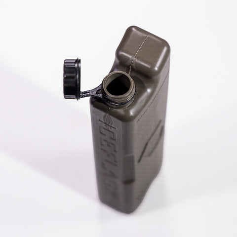 Closed Cap tether connected to bottle for hands-free carrying