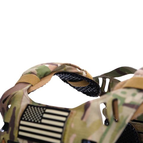 Angled close-up view of ICEVENTS Aero Shoulder Pad in Coyote Brown attached to a camouflage tactical vest.